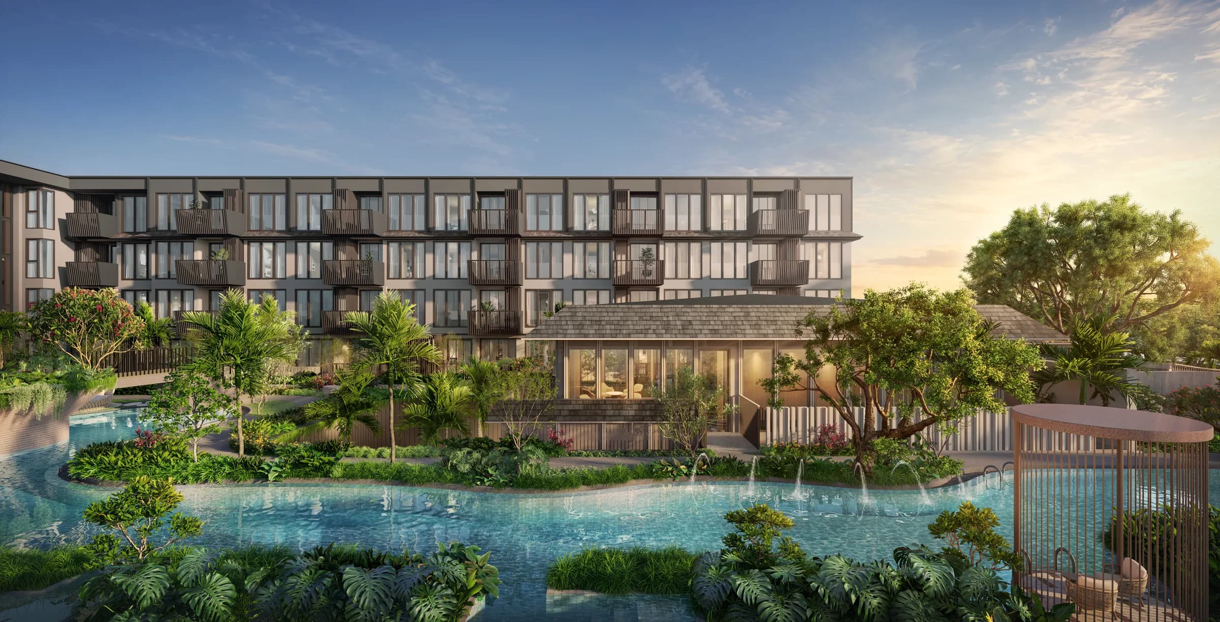 Residential buildings and lagoon pool at The Astra Samui at sunset